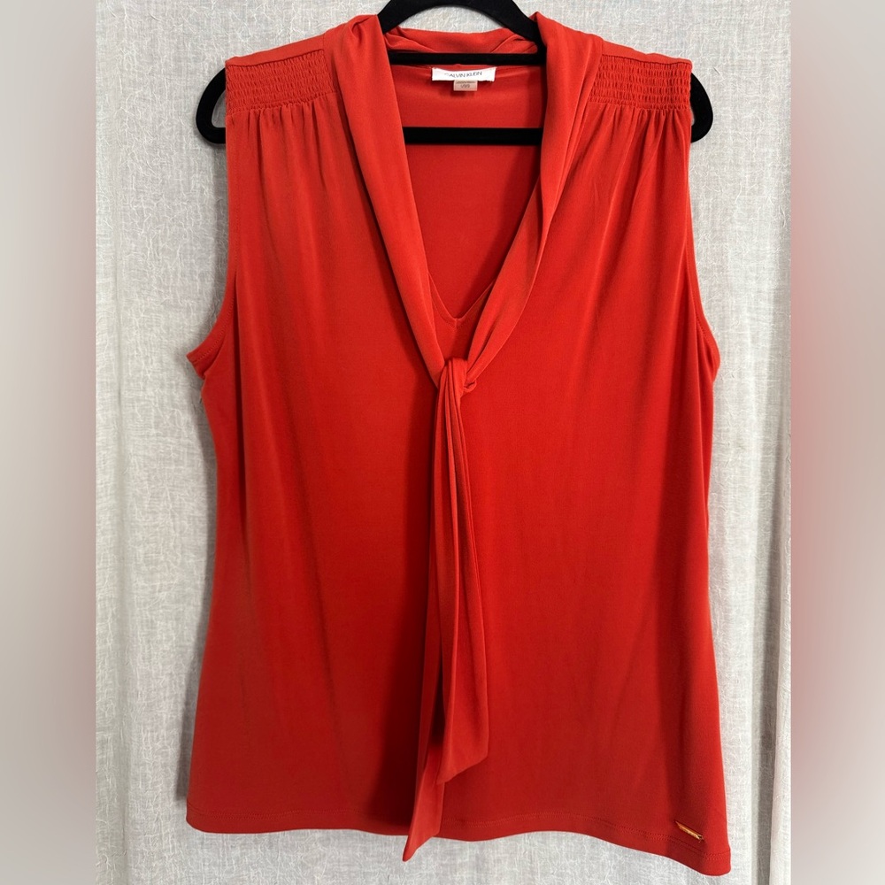 Calvin Klein Orange Sleeveless w Tie detail. Sz. L. Like new.